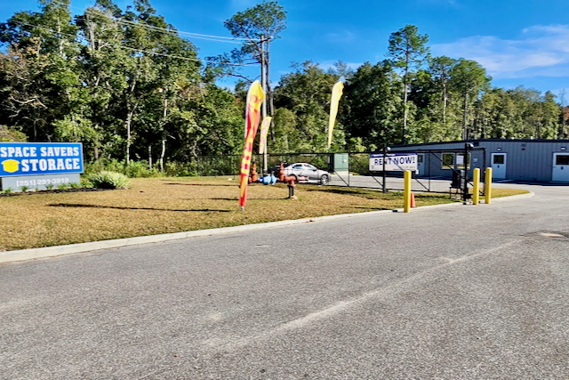 Secure front gate with code entry at Space Savers Storage, 5811 Old Pascagoula Road, Mobile, AL, ensuring safe access to climate-controlled units.